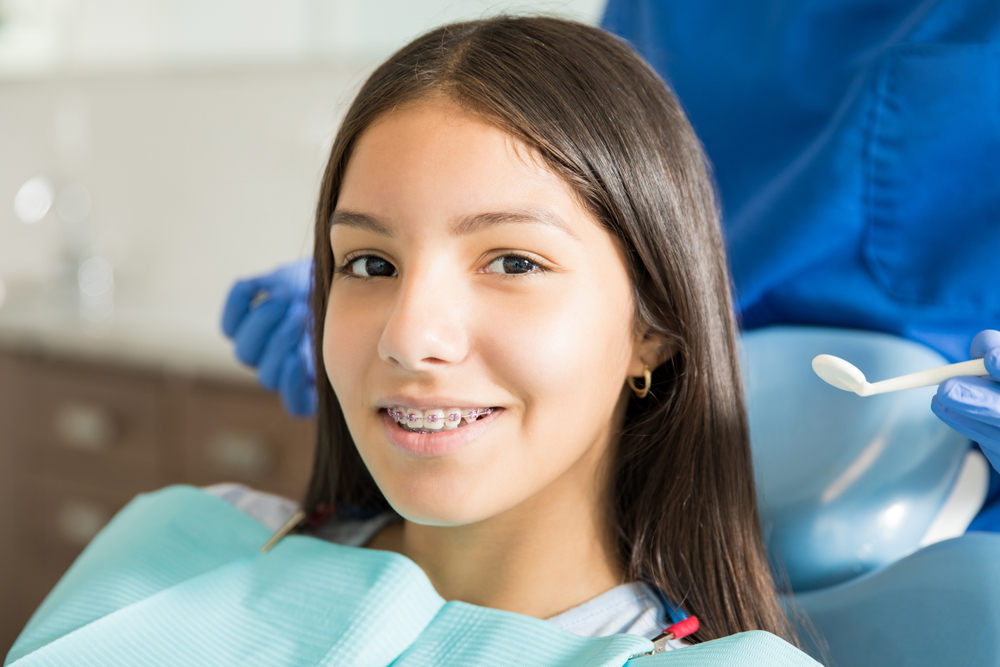 Teenage Girl with Braces (The Complete Guide to Orthodontic Treatment)