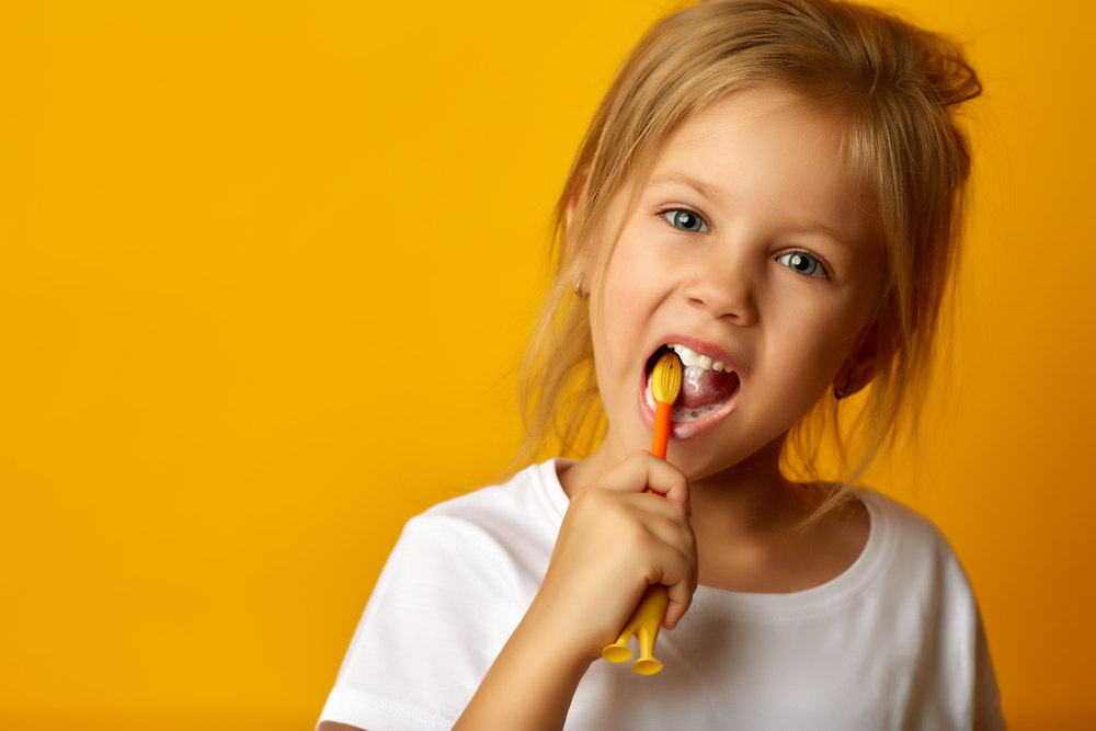 Girl brushing teeth - Preventing Tooth Decay in Children